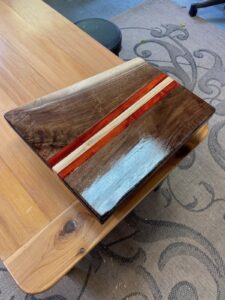 Walnut cutting board with Paduk and maple inlay